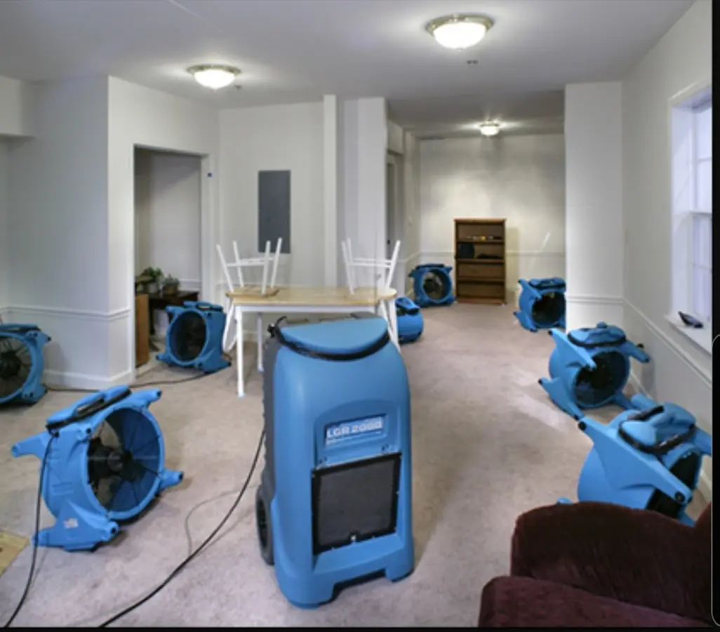 Air movers and dehumidifier setup for Water Damage Restoration in Manville